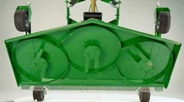 Underside of a green mower deck featuring three rotary blade housings, structural framing, and rear gauge wheels