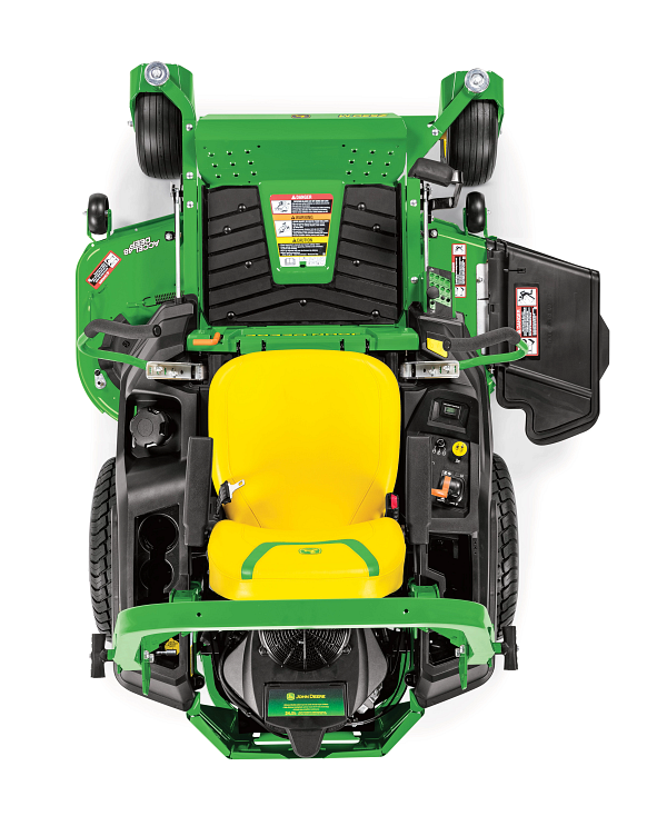 Top-down view of a zero-turn mower showing the yellow seat, control levers, foot platform, mower deck, and discharge chute