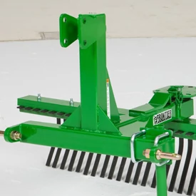 Agricultural rake attachment with multiple spring tines, adjustable frame, and mounting bracket.