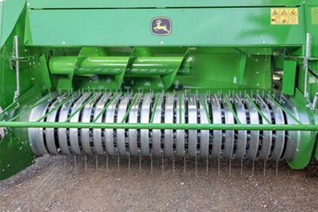 Front, close-up view of a S200 Small Square Baler's 2-m wide pickup feeder and teeth