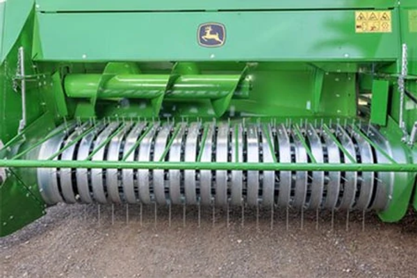 Front, close-up view of a S200 Small Square Baler's 2-m wide pickup feeder and teeth