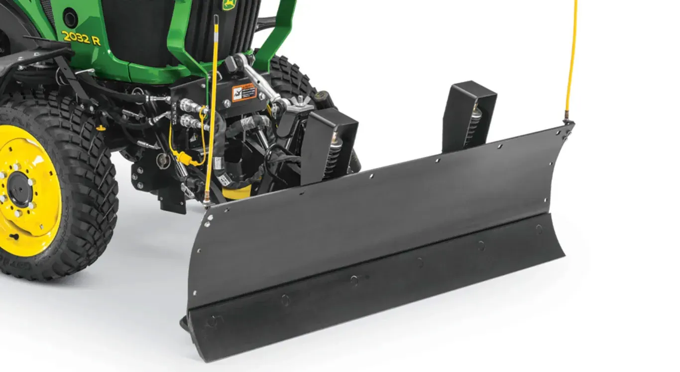 Front right studio view of the 366 Front Blade attached to a compact utility tractor