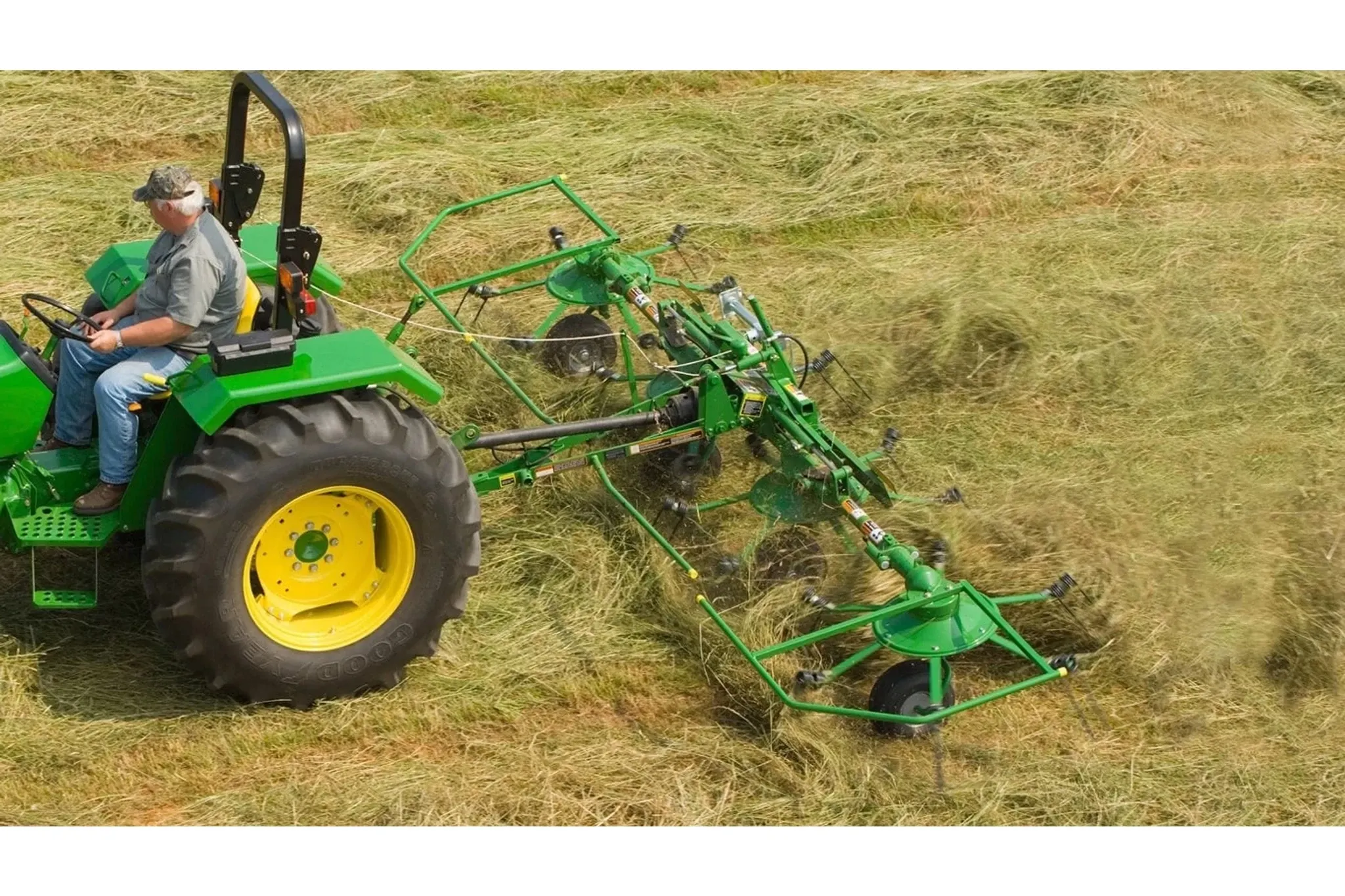 TD13 Hay Tedder fluffing hay in a field