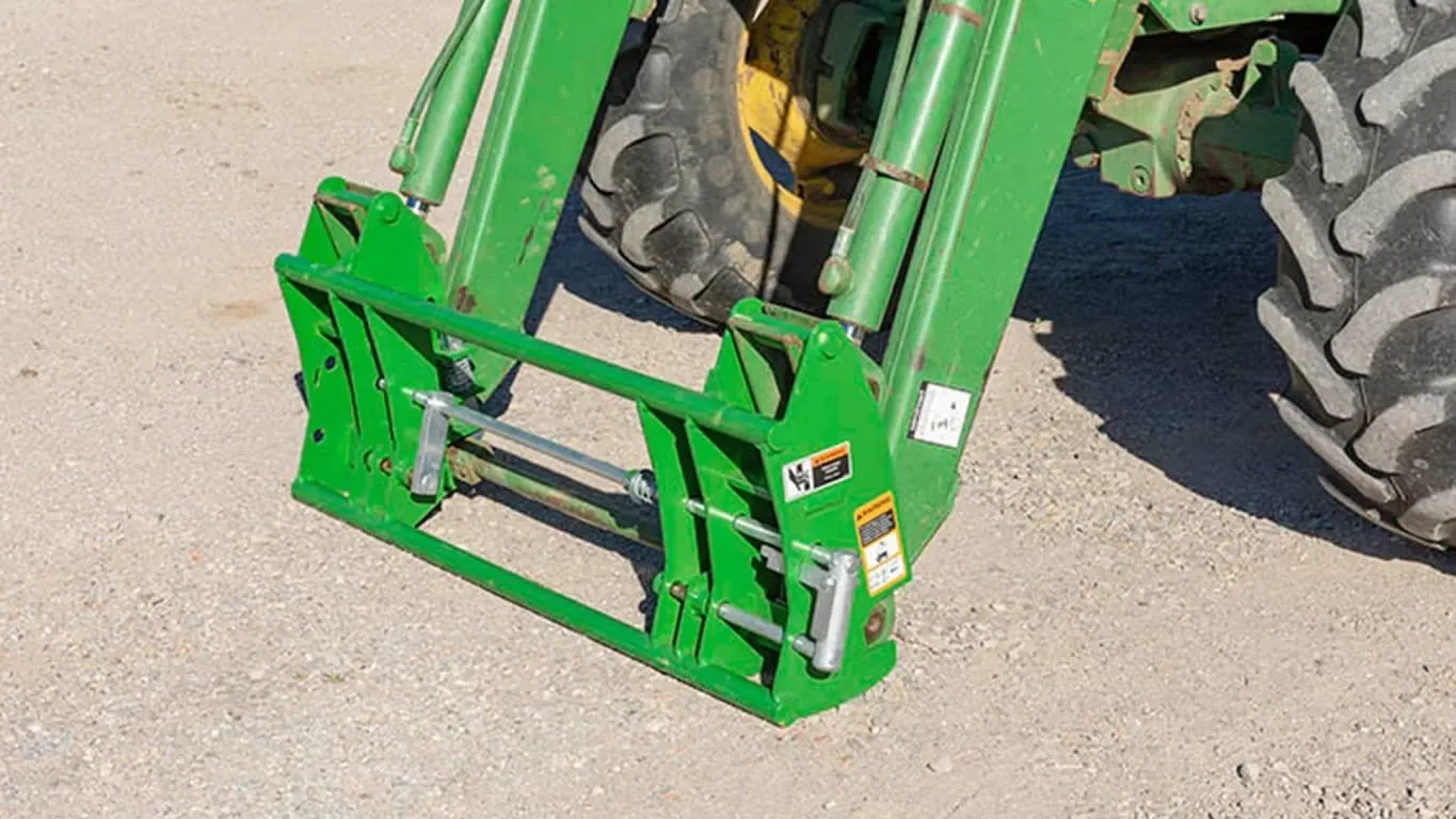 GA22D Loader Adapter attached to tractor on dirt