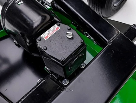 Close-up studio view of a Frontier grooming mower's black-painted mechanical component