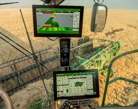 Two-screen G5Plus CommandCenter™ setup in a harvester's interior cab