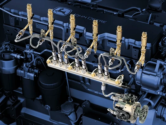 Close-up of a diesel engine fuel injection system showing high-pressure fuel lines, injectors, and a fuel rail mounted along the engine block