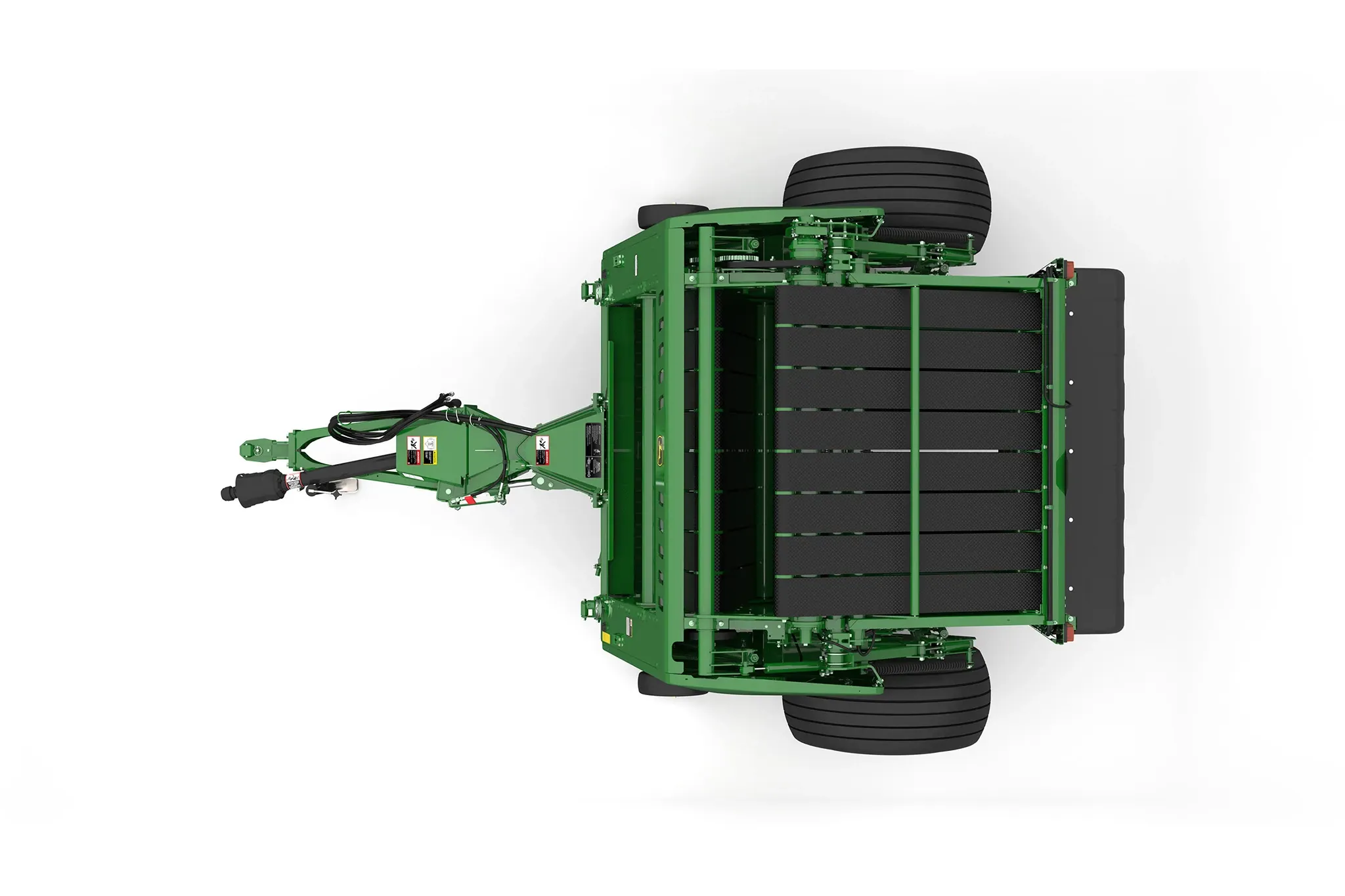 Studio rendering of 561M round baler top-down view on a white background, showing the tow hitch, hydraulic hoses, bale chamber belts, large rear tires, rear storage compartment, and overall machine frame layout
