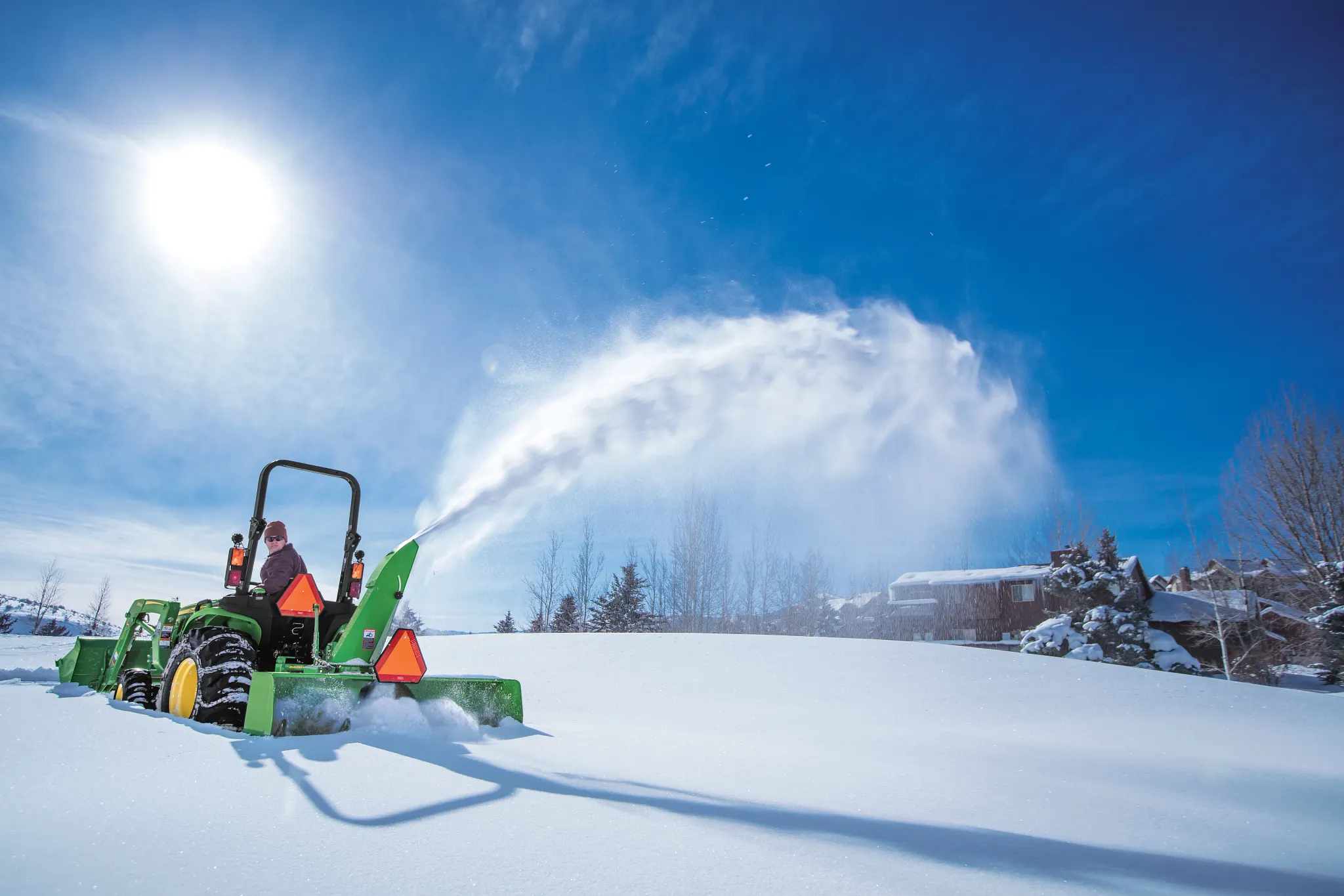 Blowing snow using a SB1154 Snowblower on 2025R Tractor