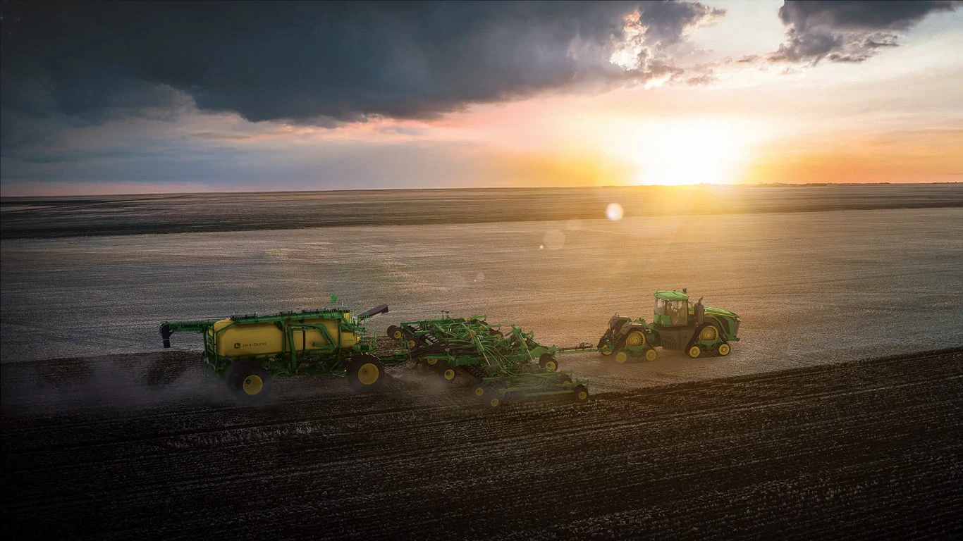 c1100t Air Cart being used in a field at sunrise