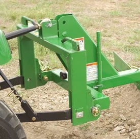 Side right view of a mounted RB2060L rear blade over a dirt patch