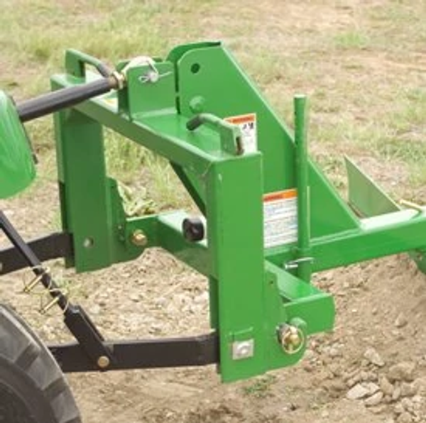 Side right view of a mounted RB2060L rear blade over a dirt patch