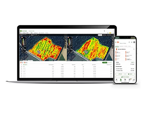 Computer and smartphone side by side showing the transfer of data to the John Deere Operations Center.