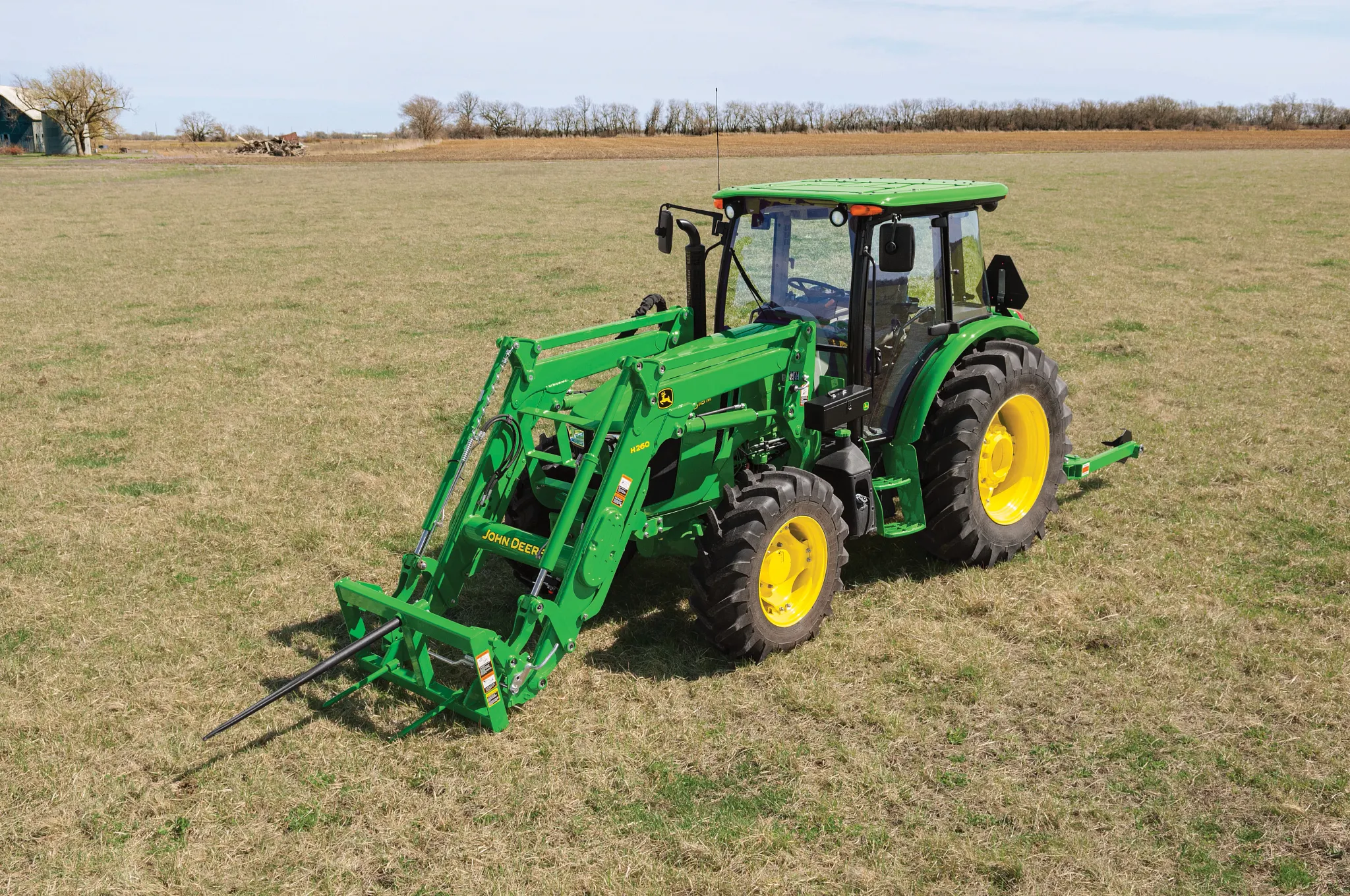 front left view of a tractor with a bale spear