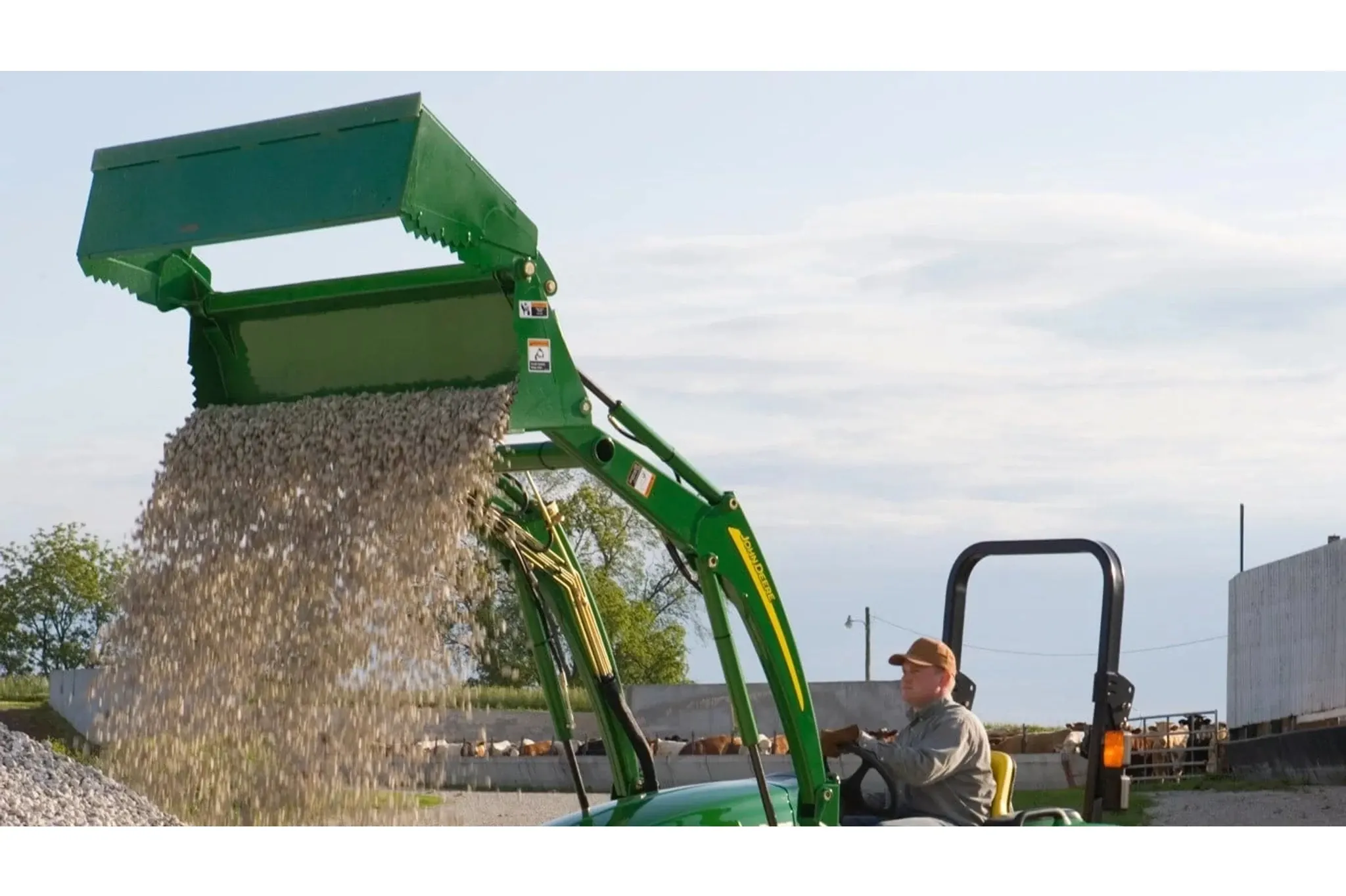 Front left view of AY12G Series 4-in-1 Bucket dumping gravel