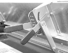 Close-up, angled view of a TD100 Top Dresser's silver metering gate