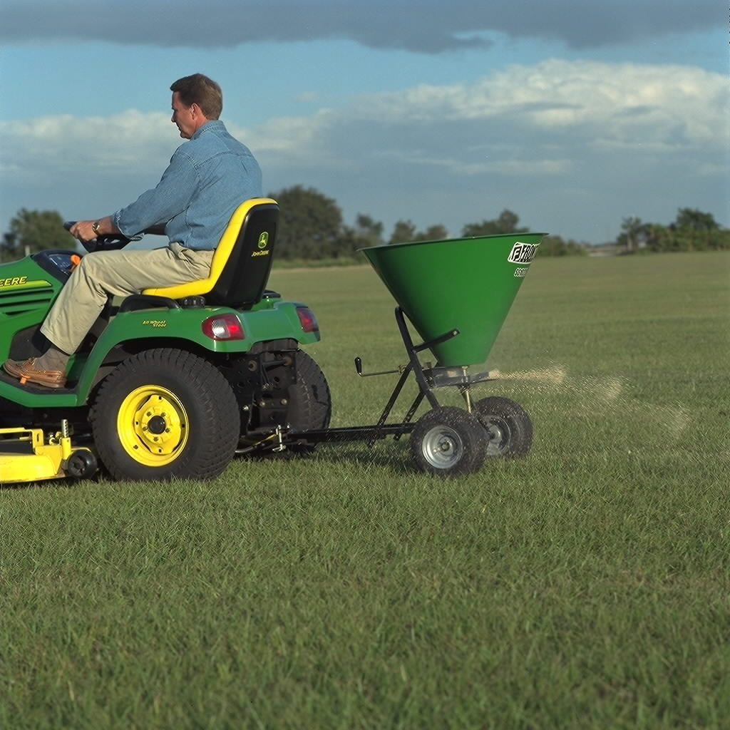 Field view of SS1022B spreader on lawn tractor
