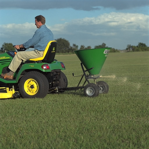 Field view of SS1022B spreader on lawn tractor