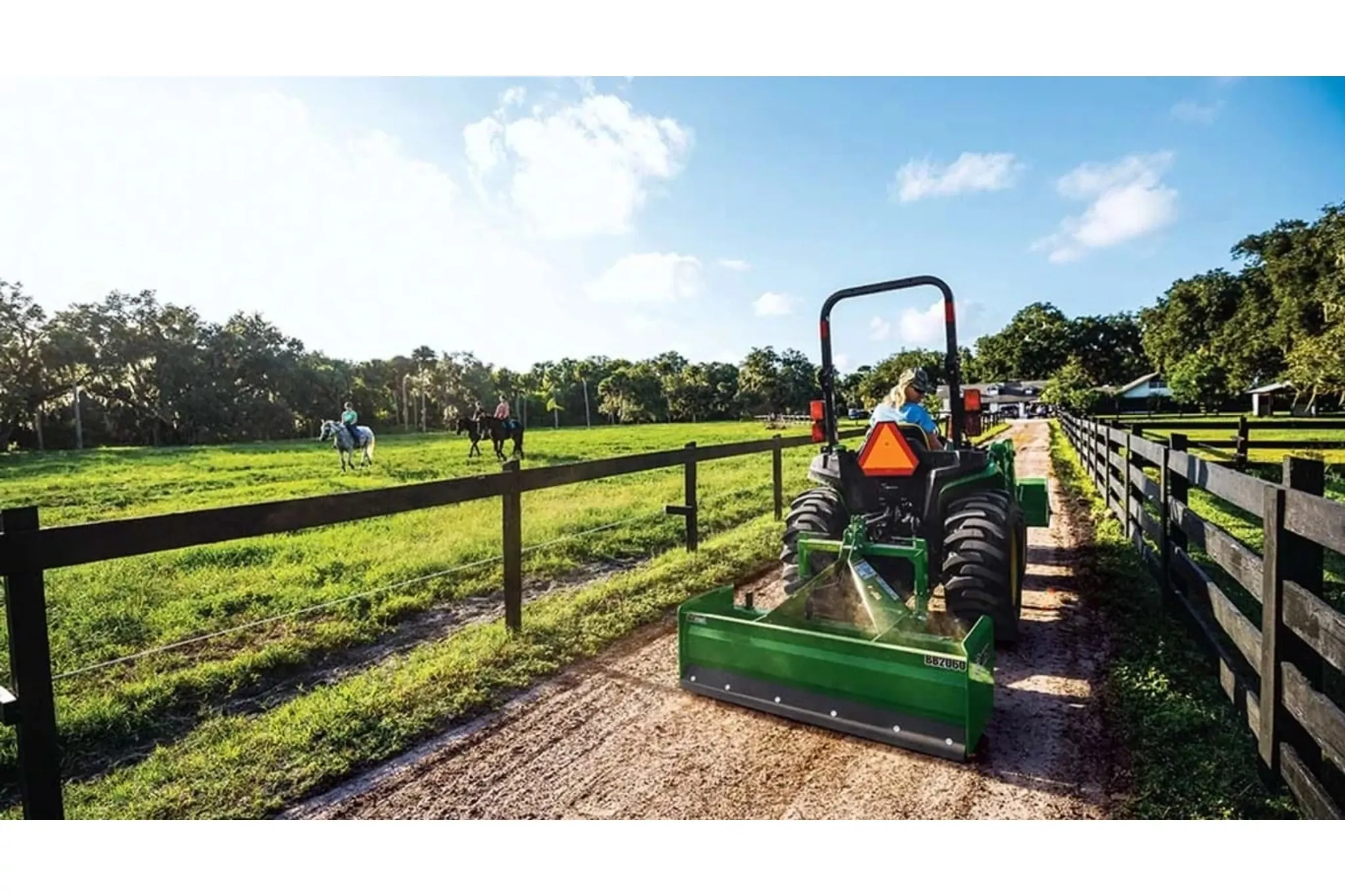 3025E 3 Series Compact Tractors with there is a tractor that is parked in a field