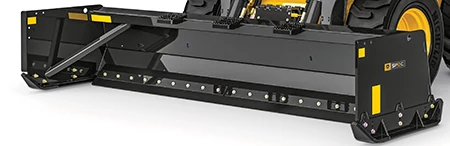Front-mounted heavy-duty black snow push with wide rectangular housing and reinforced cutting edges, shown attached to a large industrial loader
