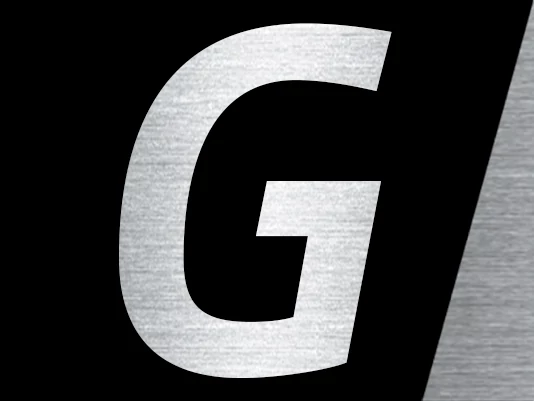 Stylized capital letter ‘G’ with a brushed metal texture on a black background, partially framed by an angled gray stripe on the right