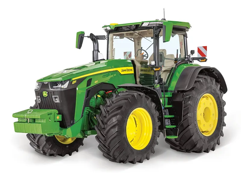 John Deere 8R tractor shown from a front‑right angle on a white background, featuring large rear tires, front weight block, and full cab