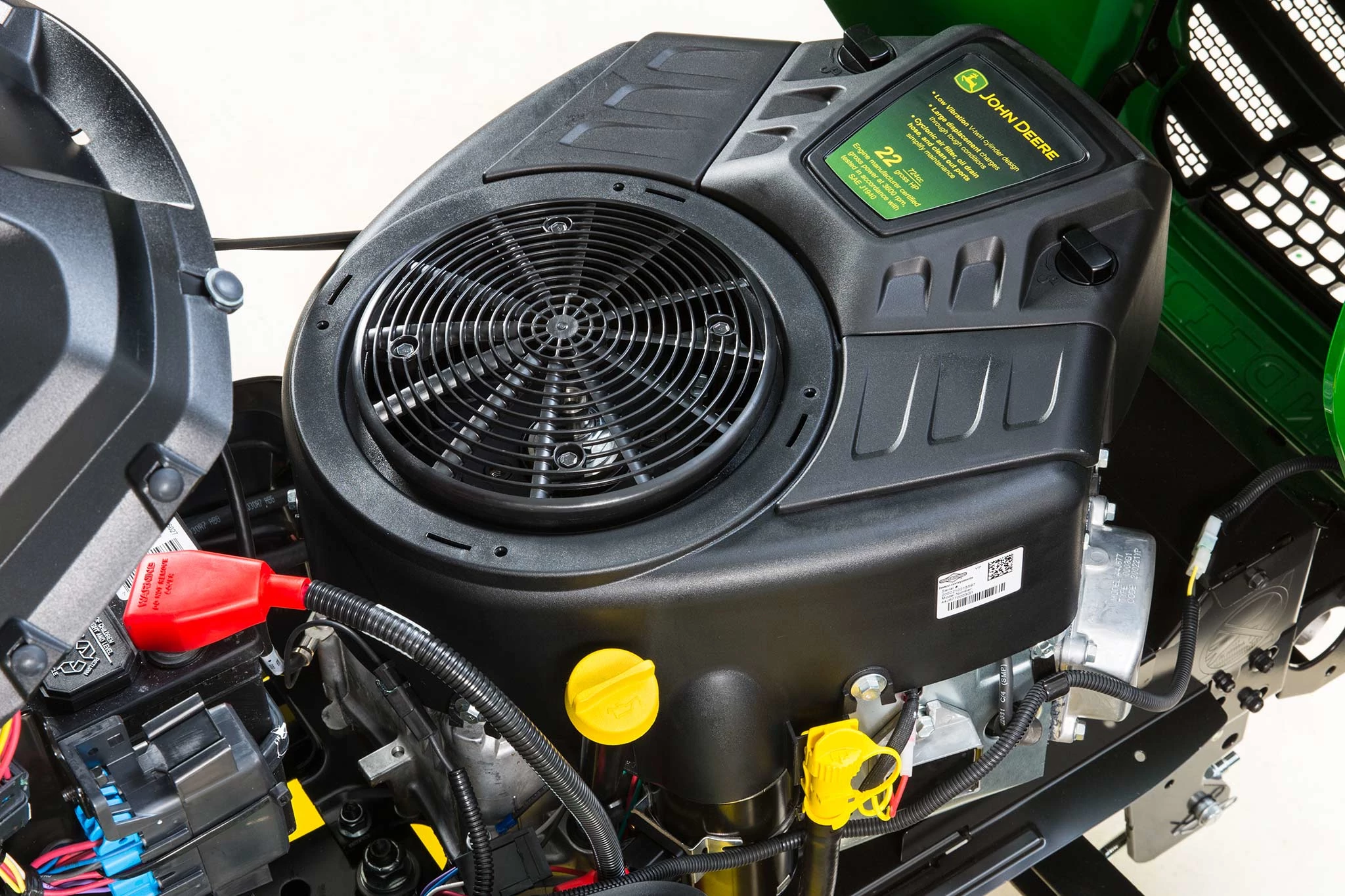 Studio close-up of an X330 riding mower's uncovered, 22-hp 22 hp Cyconlic Engine