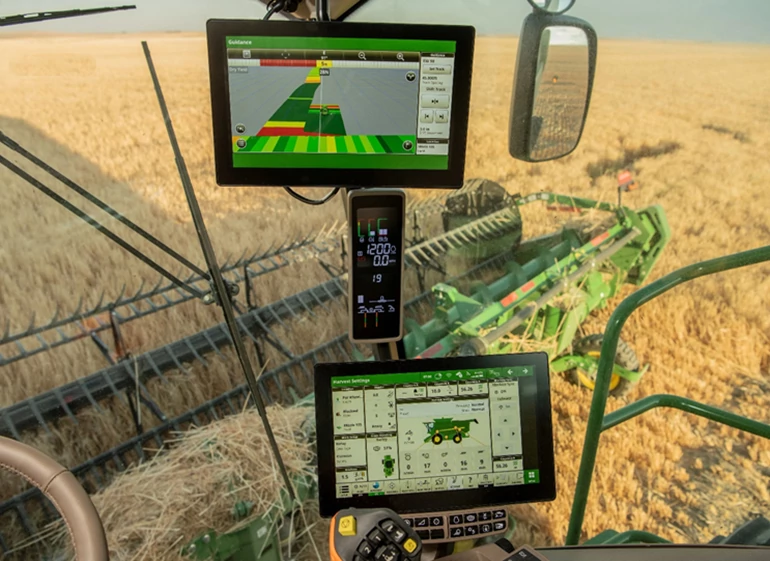 Front view of a G5 Extended Monitor vertical setup against a machine windshield with a golden field in the background.