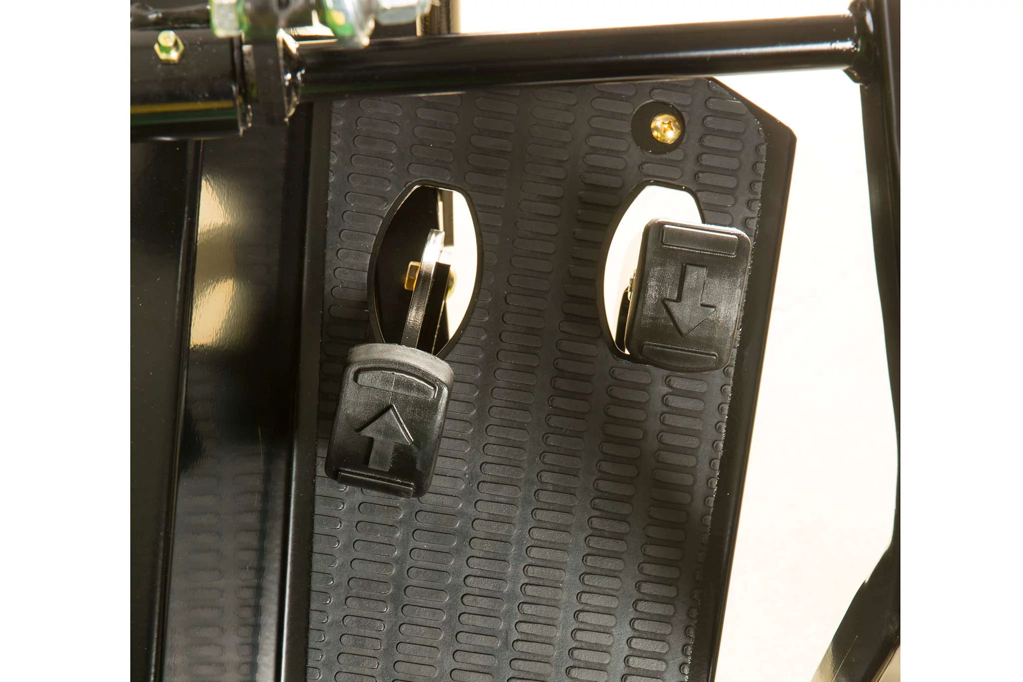 Top studio view of a TruFinish 1220 Utility Rake's forward and reverse pedals on black panel.