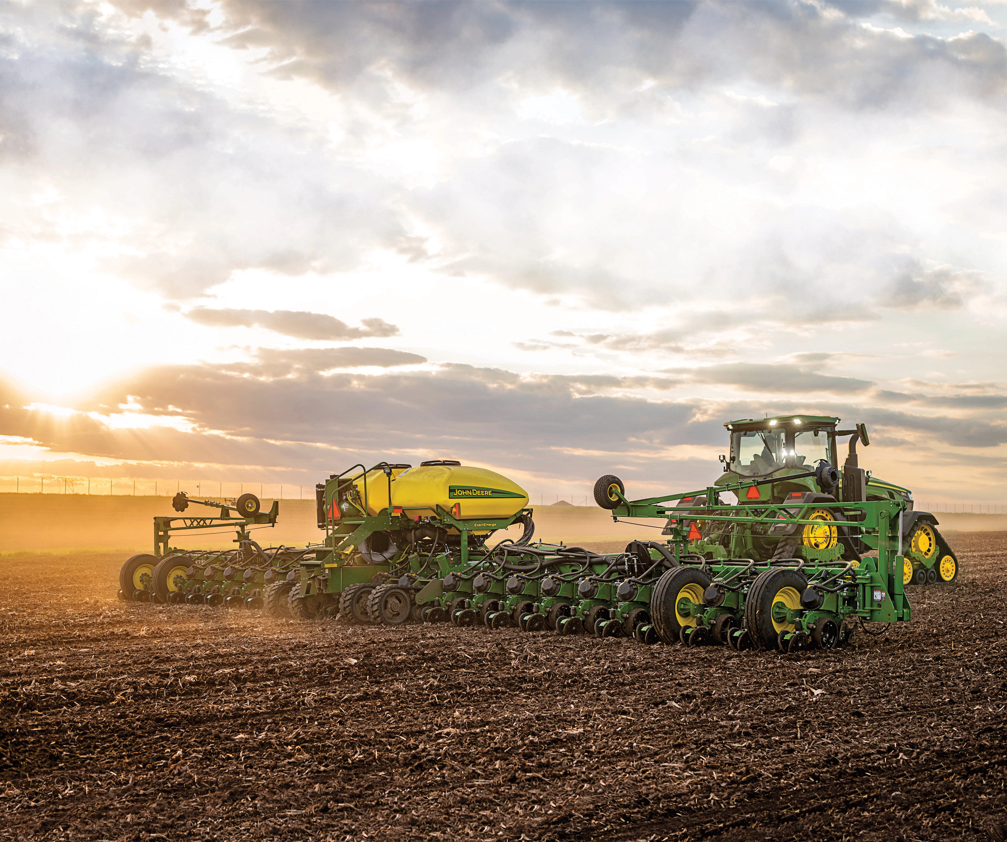 John Deere tractor and planter in the field