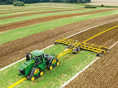 Digital projection of AutoTrac Implement Guidance Passive lines as a tractor pulls a tillage implement in the field