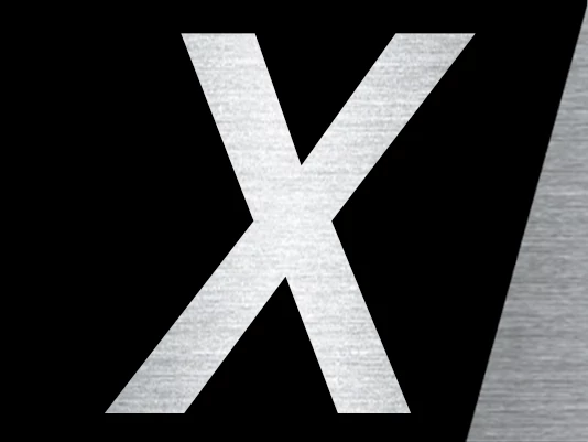 Stylized capital letter ‘X’ with a brushed metal texture on a black background, partially framed by an angled gray stripe on the right