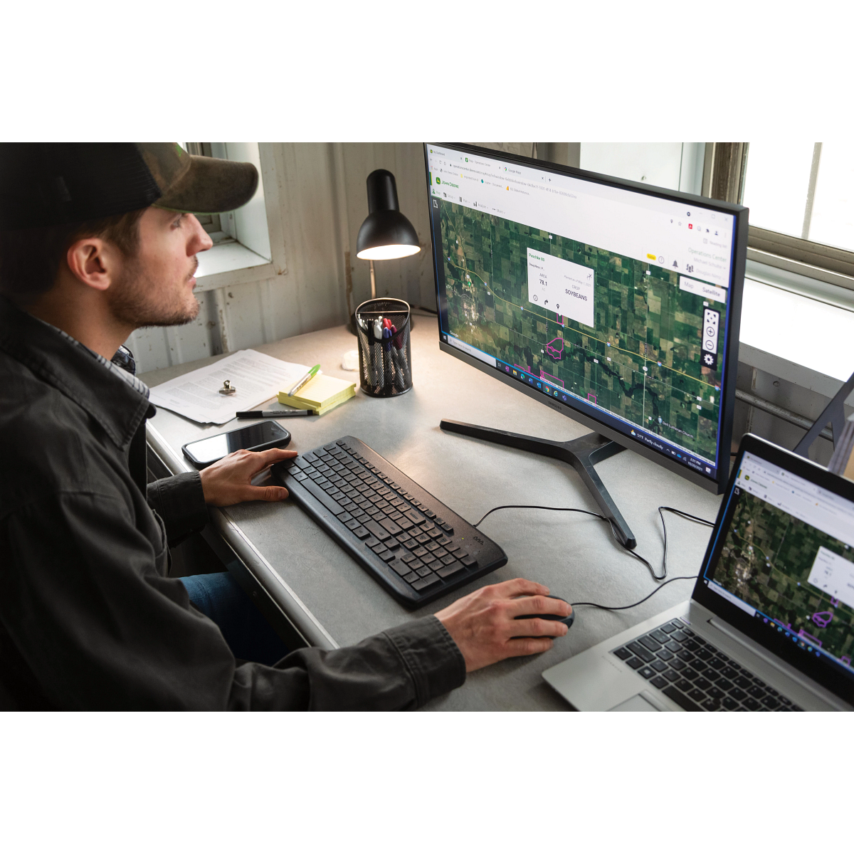 Producer reviewing field maps and data in the John Deere Operations Center — Koenig Equipment