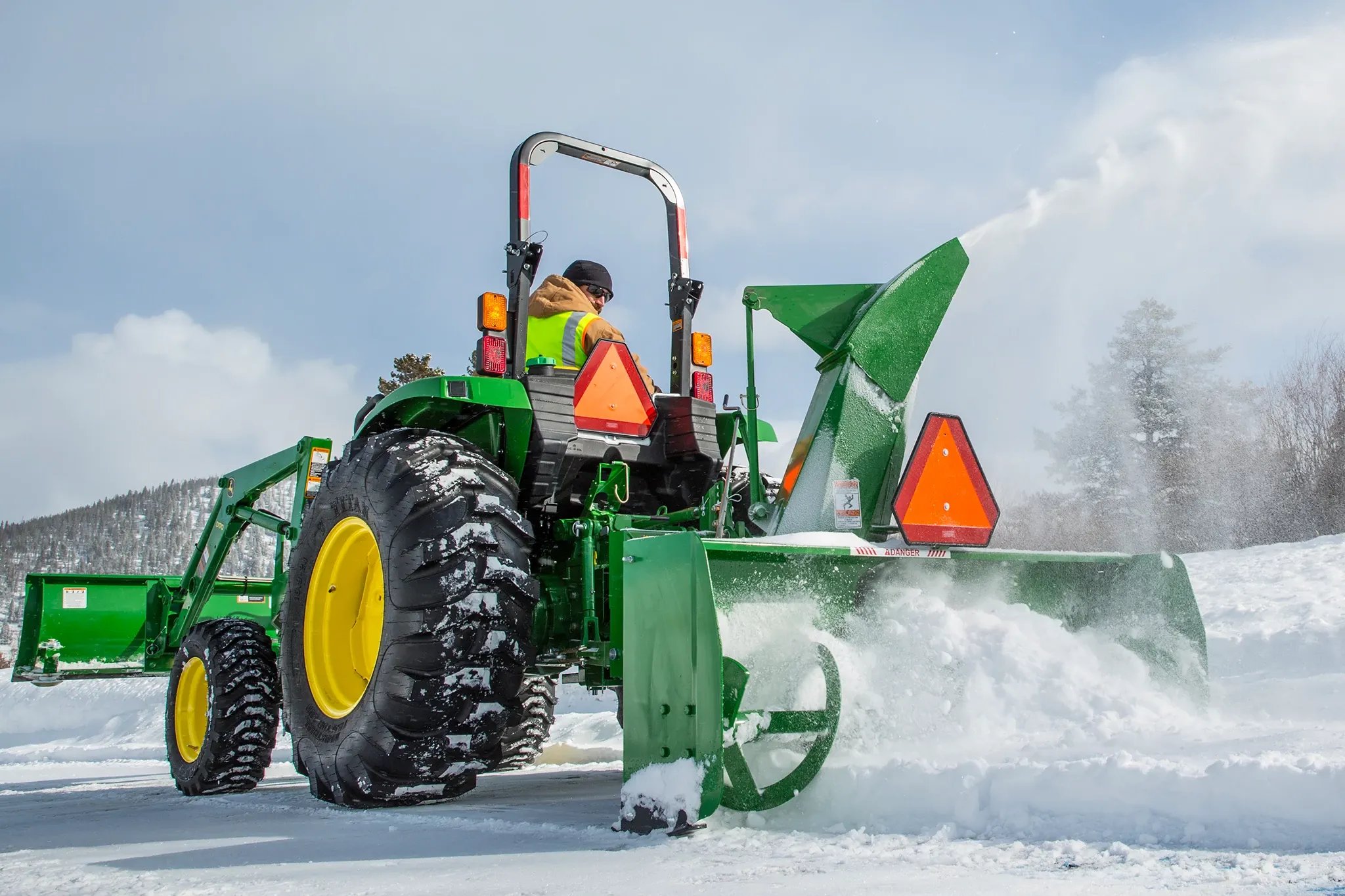 Blowing snow using a SB1174 Snowblower on 4052M Tractor on snowy drive