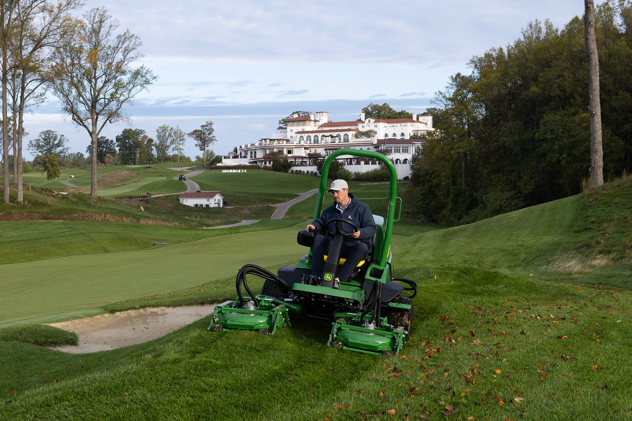 7400A TerrainCut Mower mowing around a sand trap on a golf course