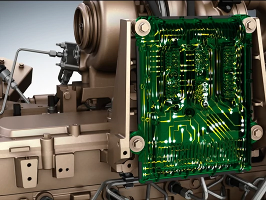 Close-up of an industrial engine showing an exposed electronic control module with a green printed circuit board attached to the engine housing