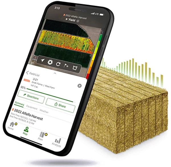 A smartphone displaying a crop‑yield map shown angled in front of a stacked hay bale graphic, illustrating digital farm data analysis
