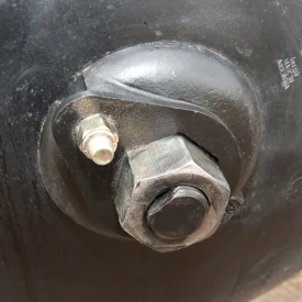 Close-up of an offset disk's end washer and nut, keeping gang tightened