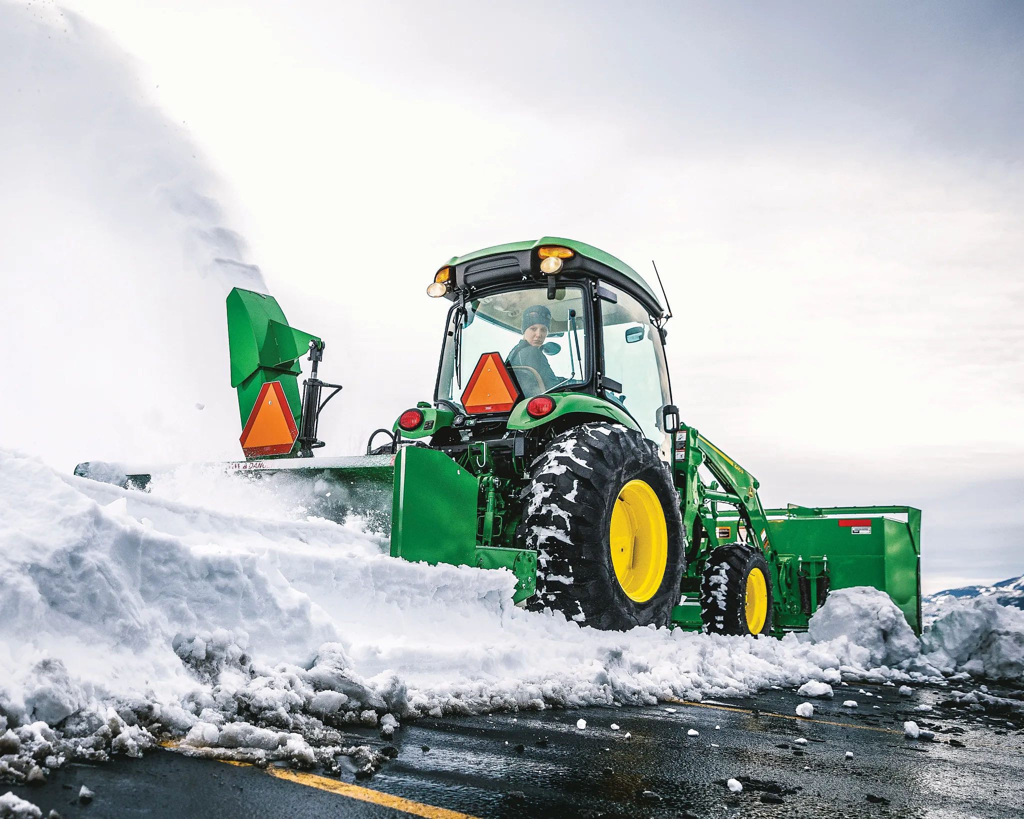 Moving snow using a SB1184 Snowblower on 4066R Tractor in a parking lot