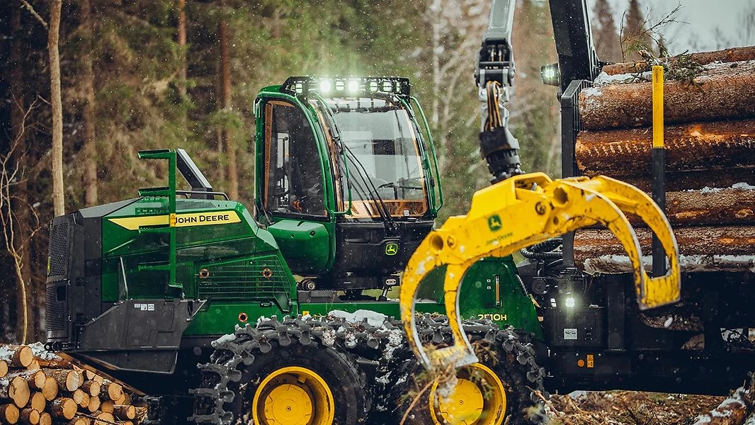 Application Equipment 2510H Nutrient Applicator with a close up of a tractor with a loader behind it