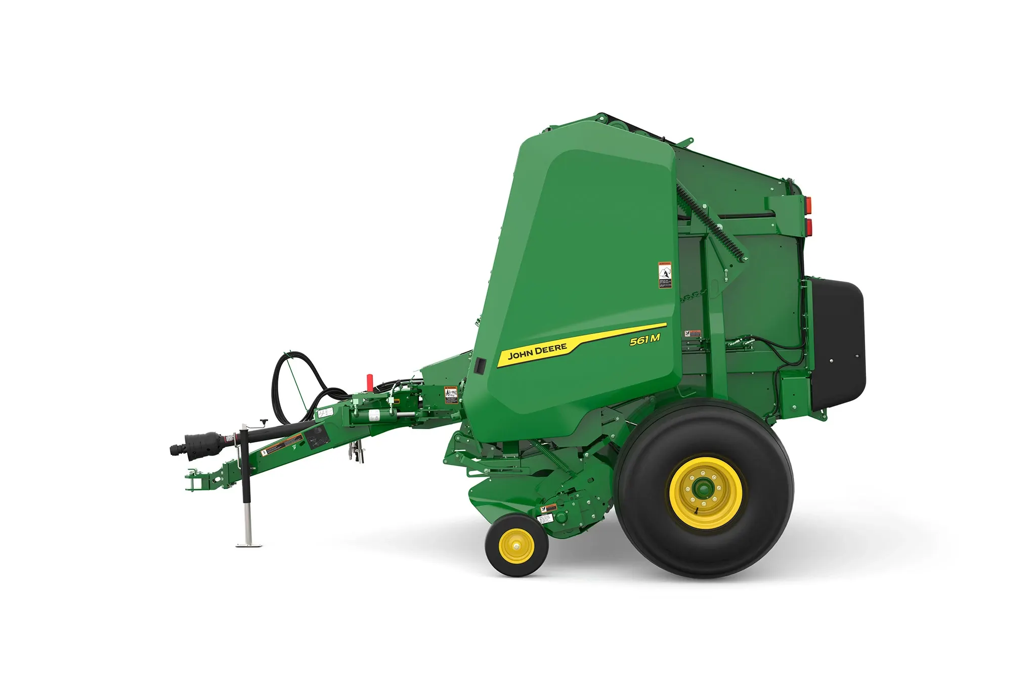 Studio rendering of 561M round baler shown in left-side profile on a white background, featuring a green body, yellow wheels, enclosed pickup assembly, rear bale chamber, hydraulic hoses, and front tow hitch