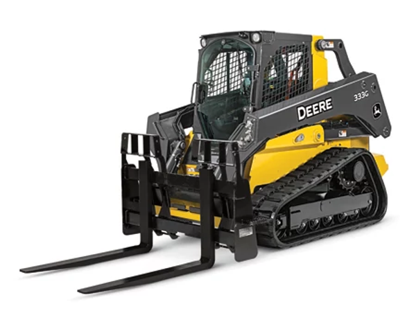 Front left studio view of a 333G compact track loader with attached PF series severe duty pallet fork resting on the floor