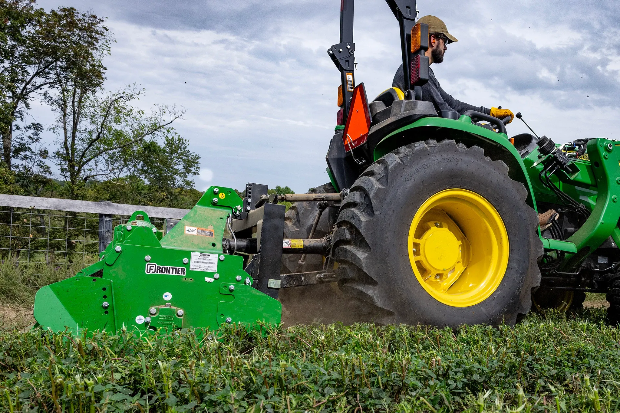 RT3062 Rotary Tiller on 3025E Tractor in a field