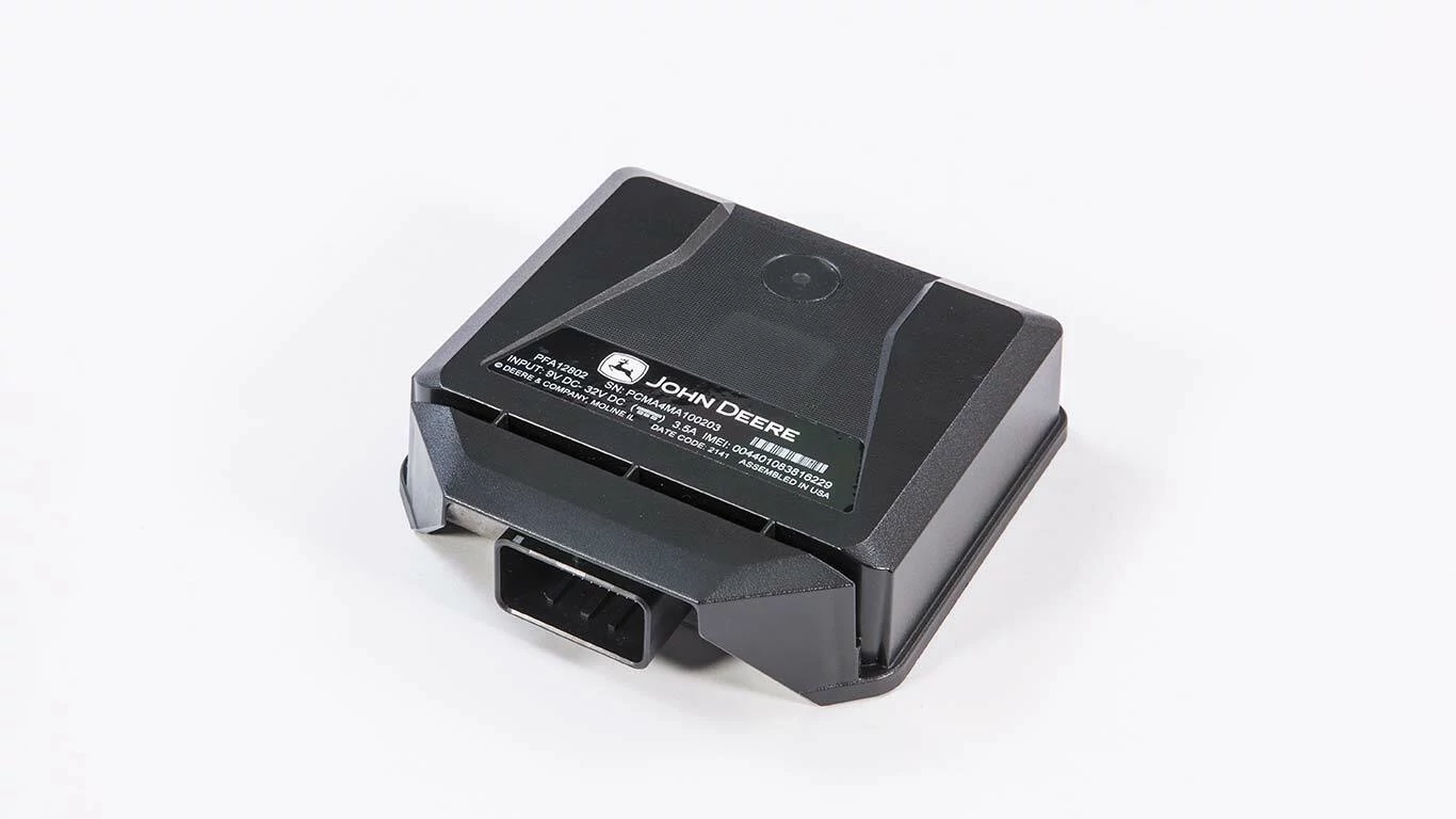 John Deere electronic control module in a black housing with connector port, placed on a white background