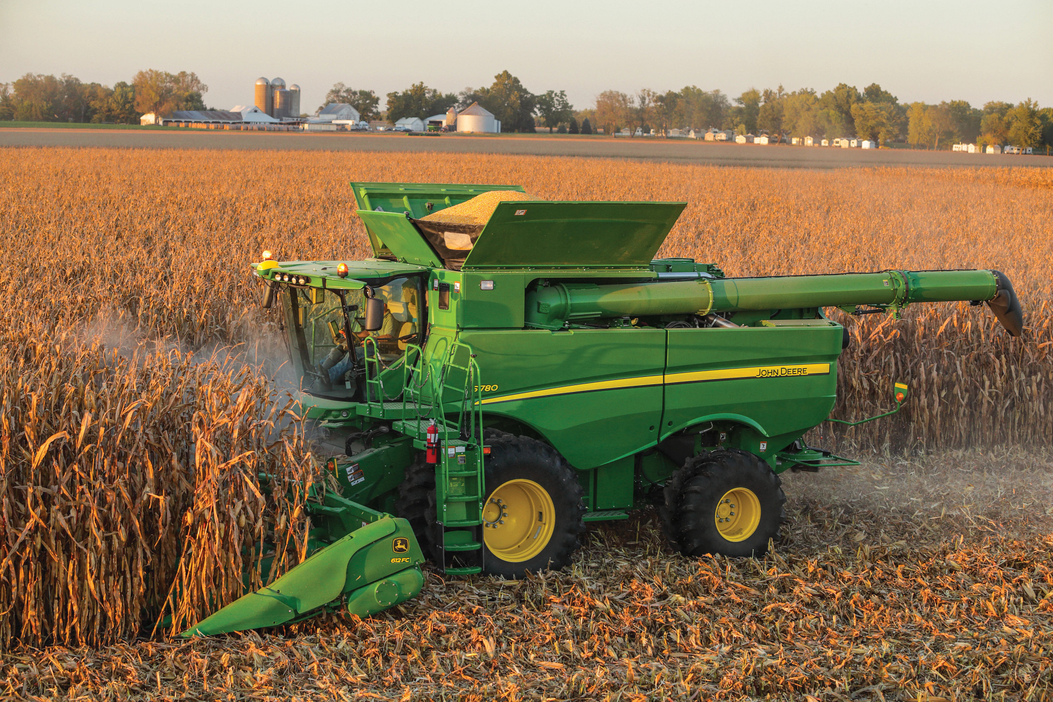 John Deere combine harvesting corn in Joslin, Illinois