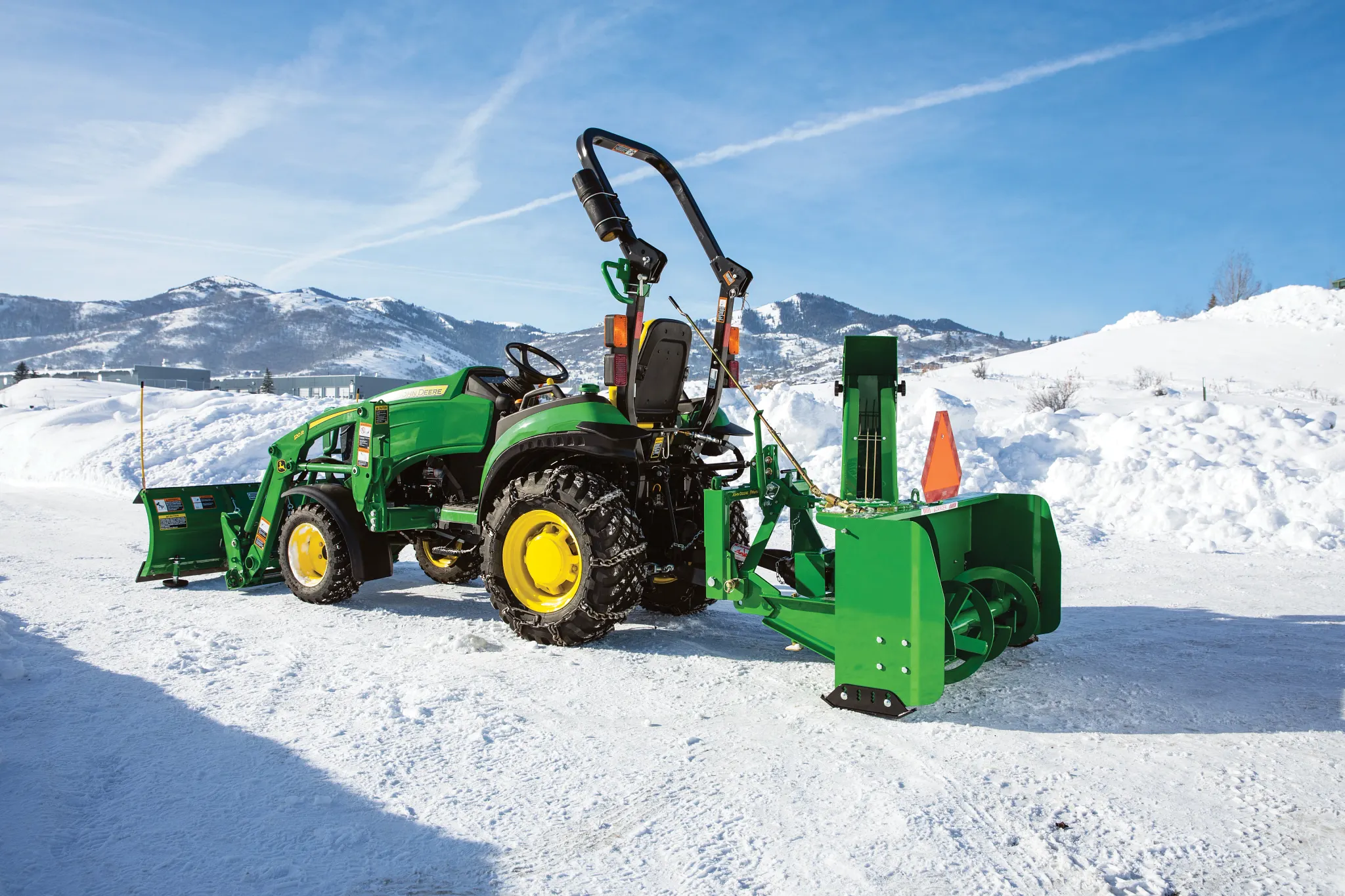 SB1154 Snowblower on 2025R Tractor on a snowy driveway