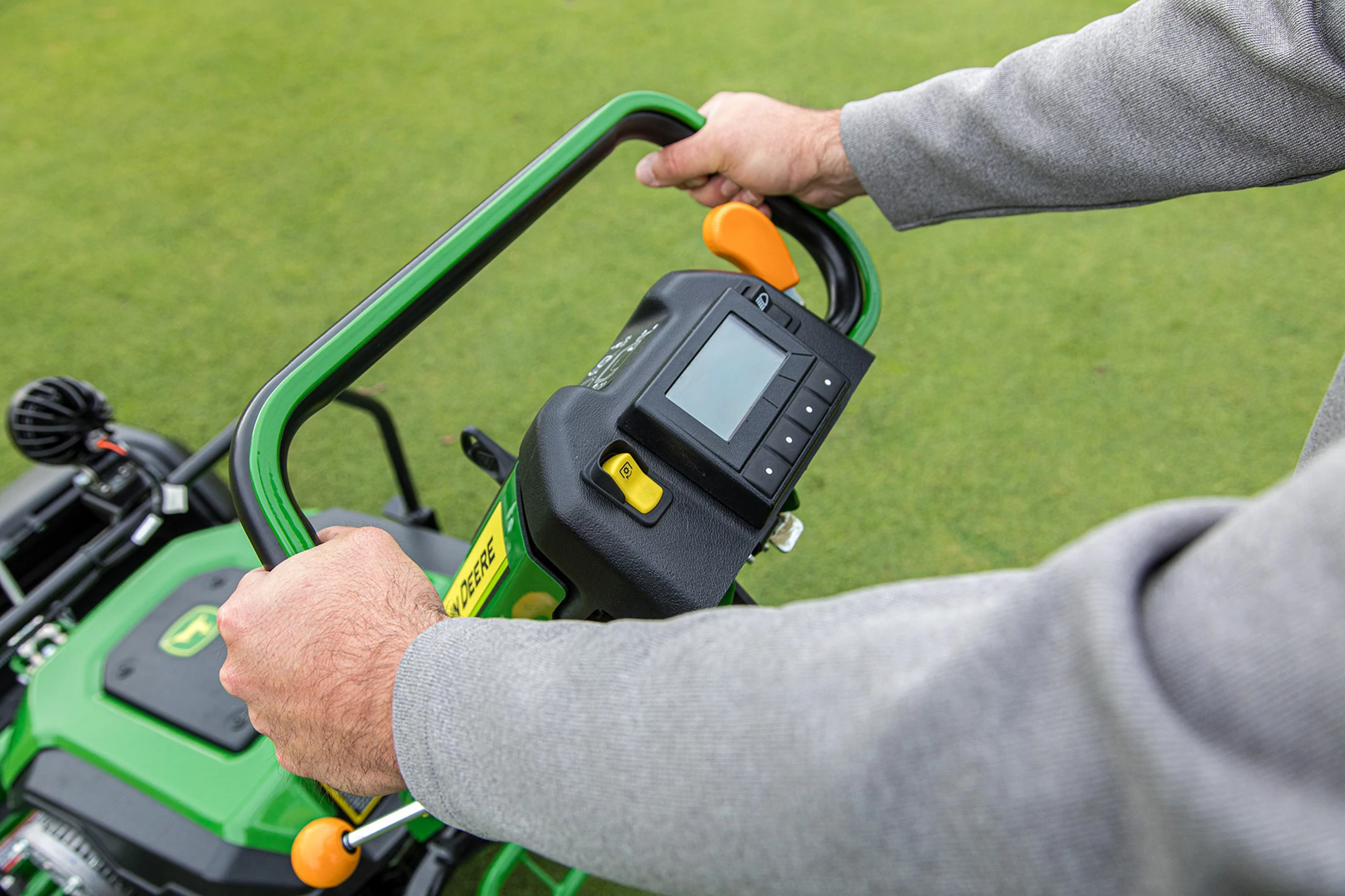 Close up view of the controls of an E-Cut Electric Walk Greens Mower