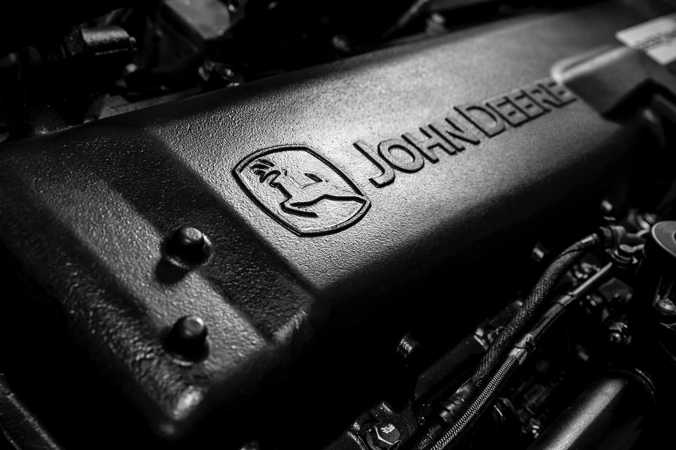 John Deere logo stamp on black engine block