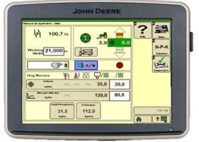 Touchscreen display showing a farming equipment control interface, with icons, gauges, numerical readouts, and settings on a light-colored screen