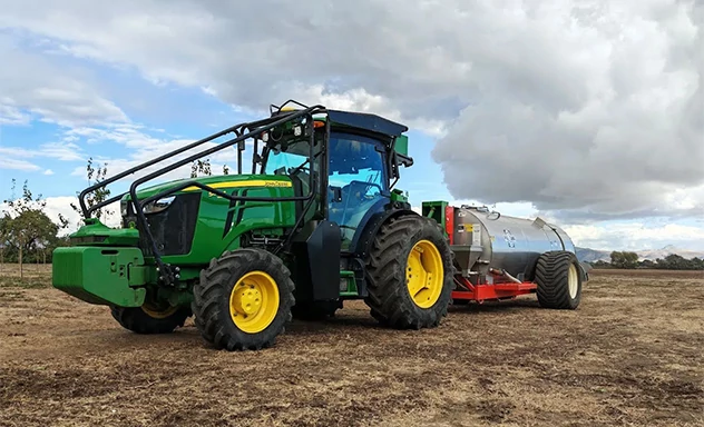 Tractor hitched to an implement in the field